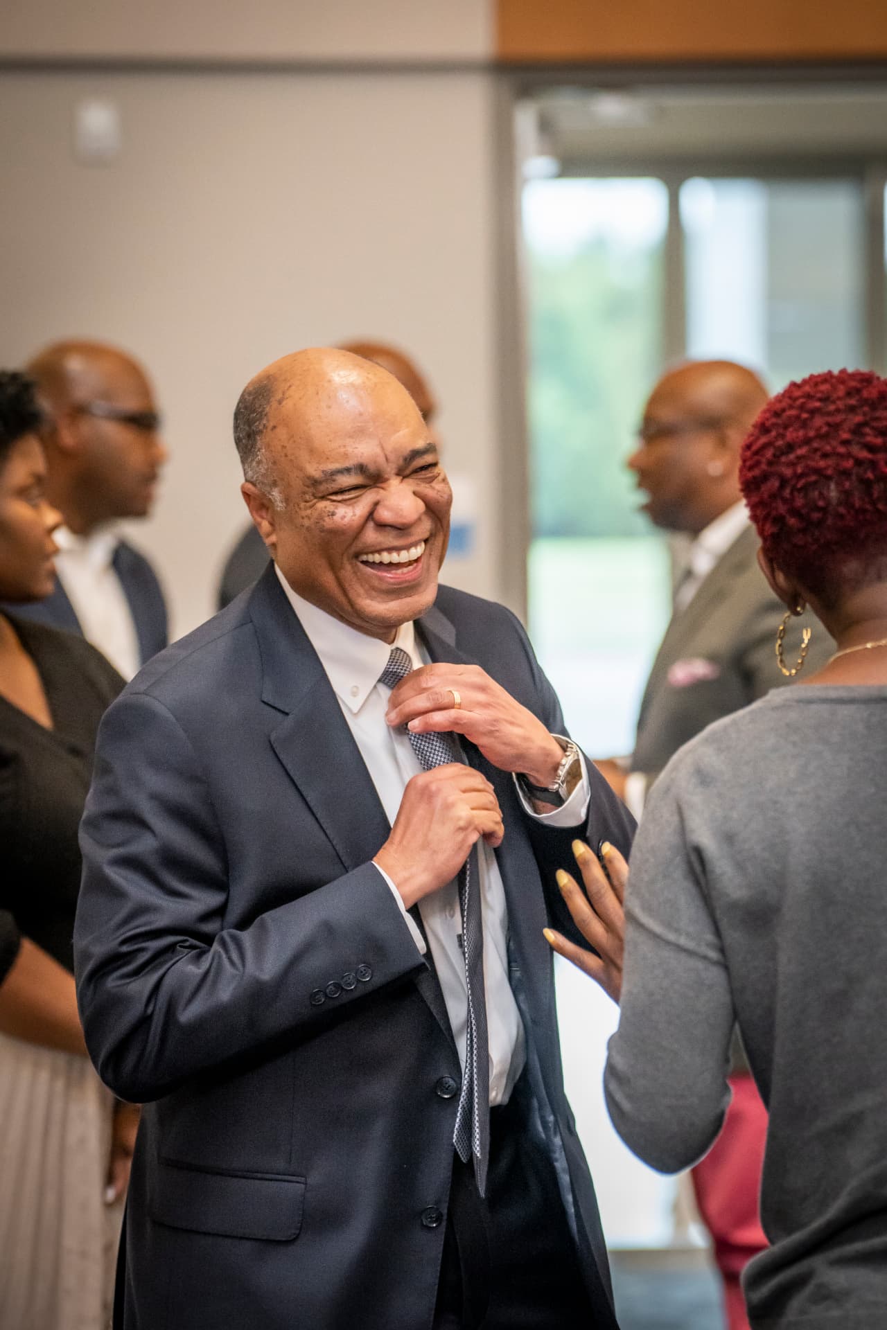 A guest sharing a laugh before the program at The Gold Chair