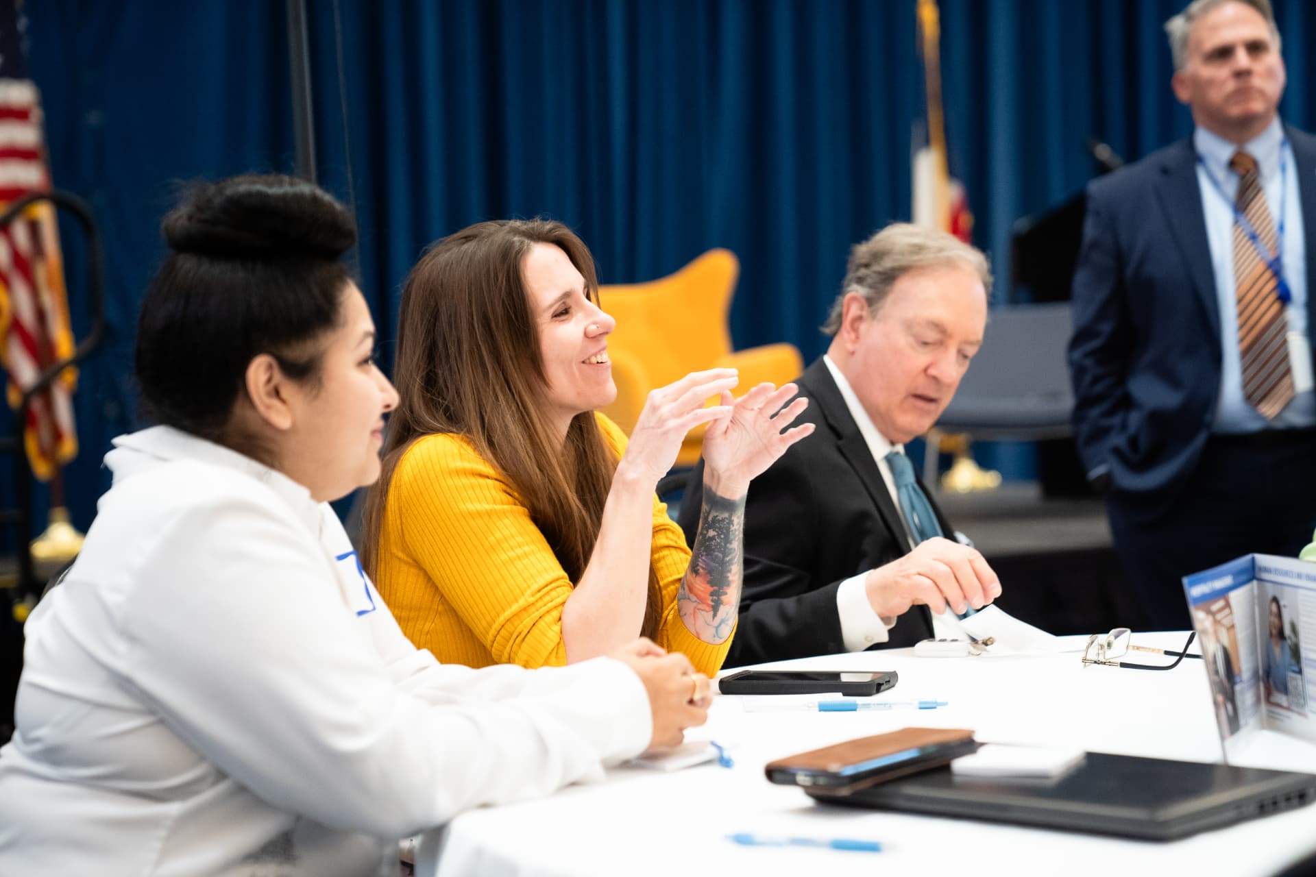 Guests and faculty in conversation at The Gold Chair luncheon