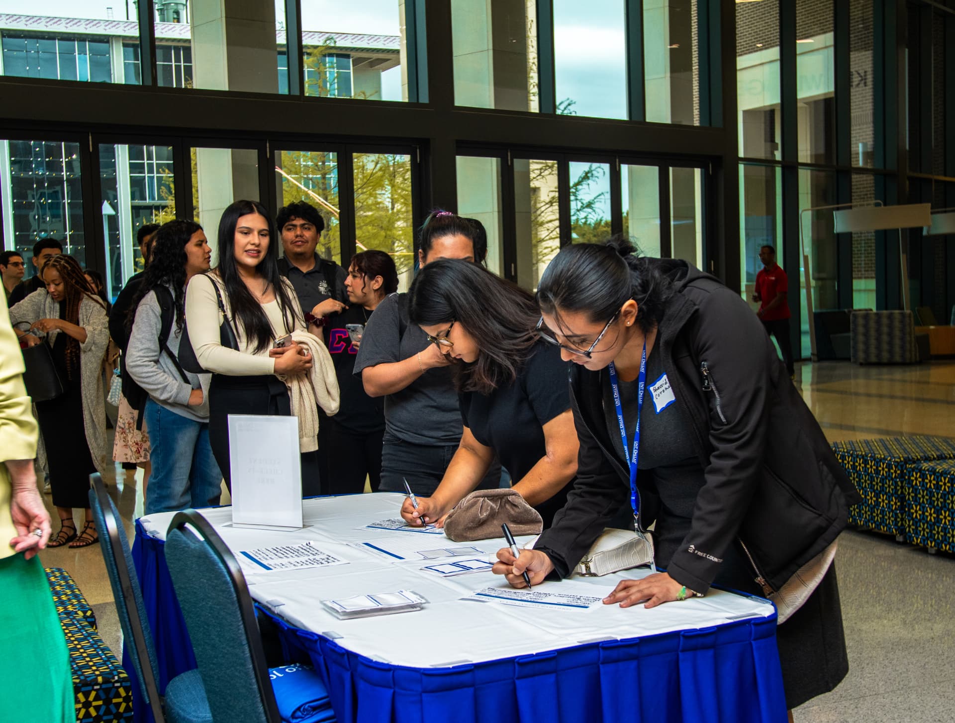 Guests checking in at The Gold Chair welcome desk