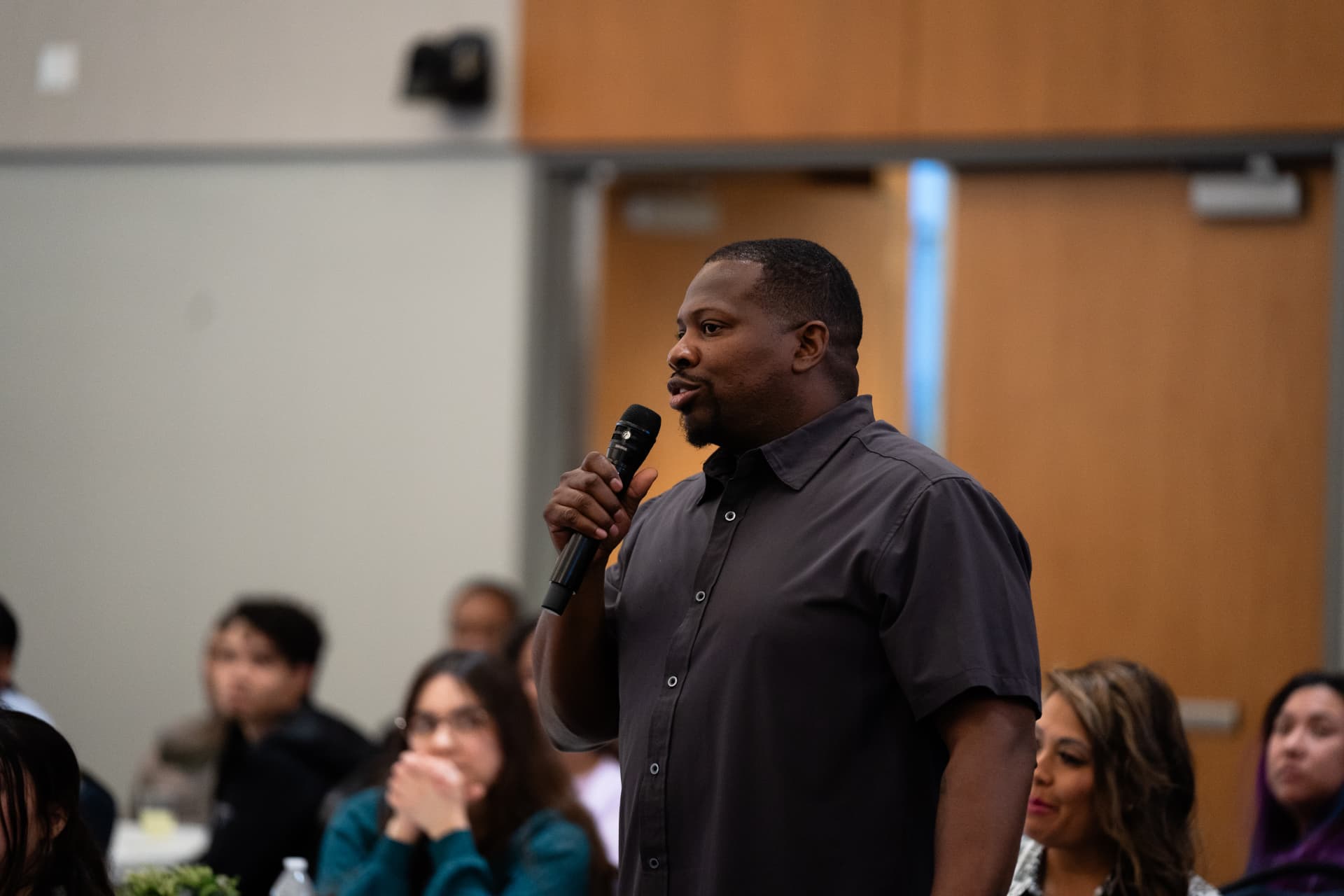 An audience member asking a question at The Gold Chair