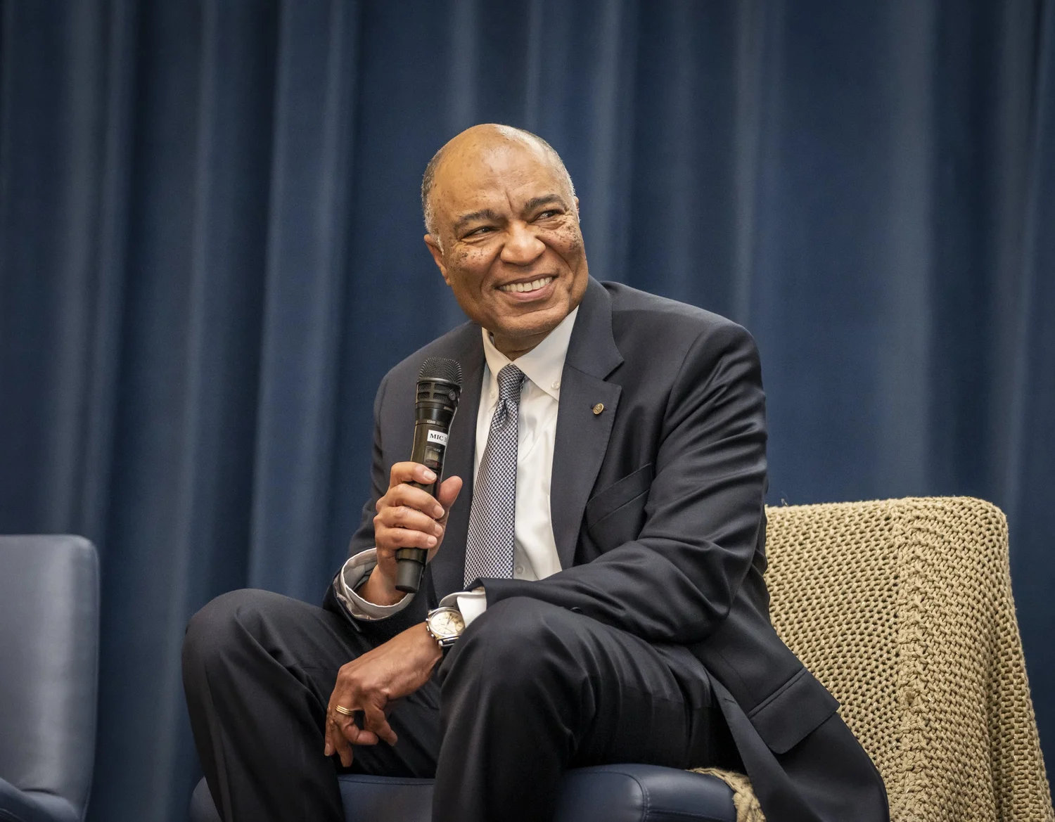 A speaker sharing leadership insights at The Gold Chair