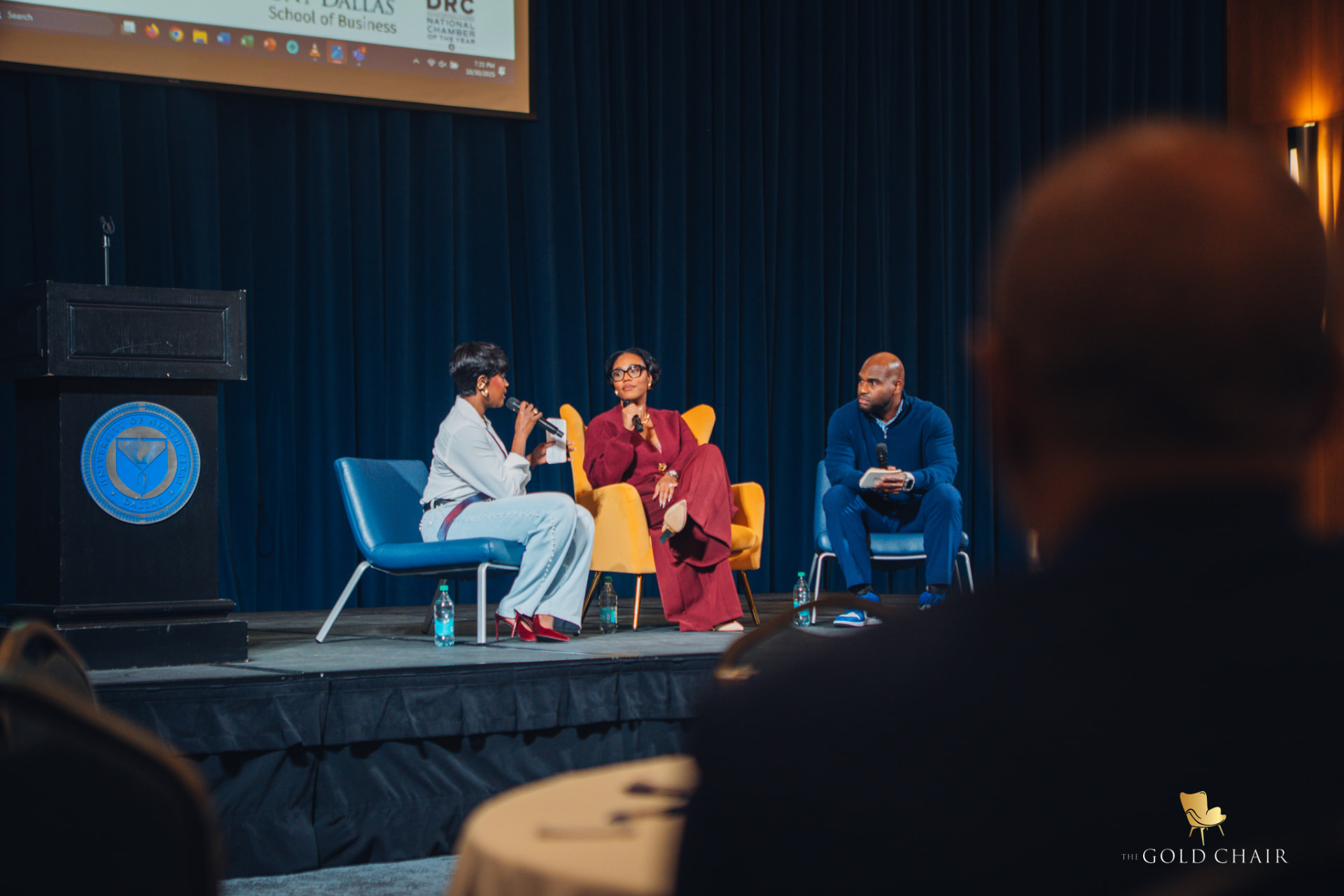 A hosted conversation on stage at The Gold Chair